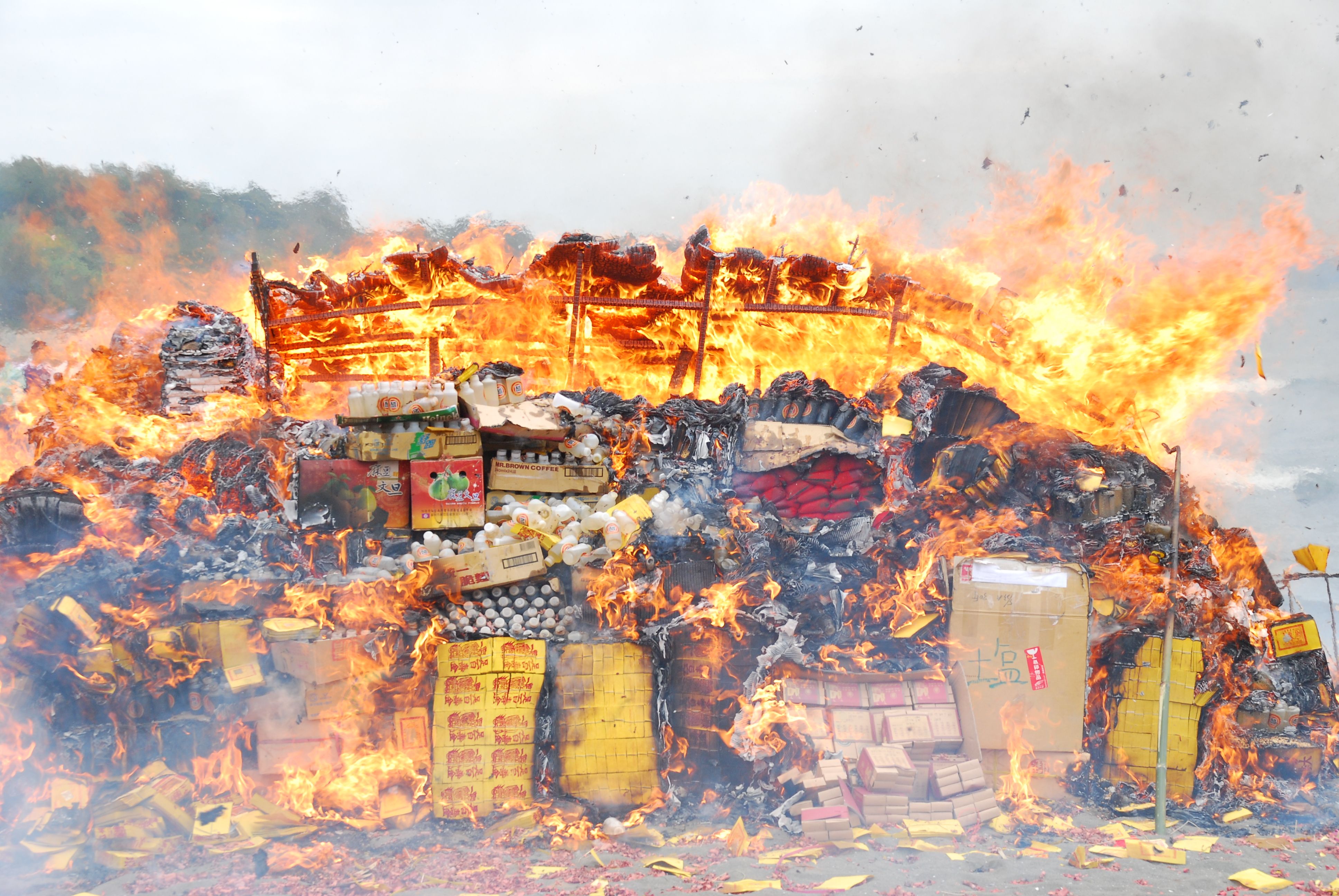A house burning down, it is in a terrible state